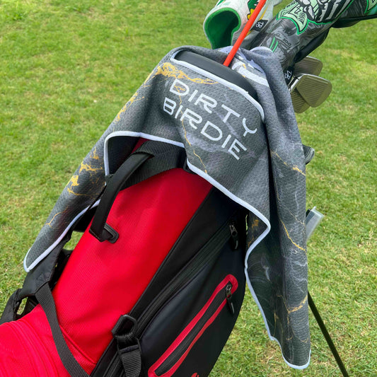 Sleek black towel with bold lightning design hooped on golf bag