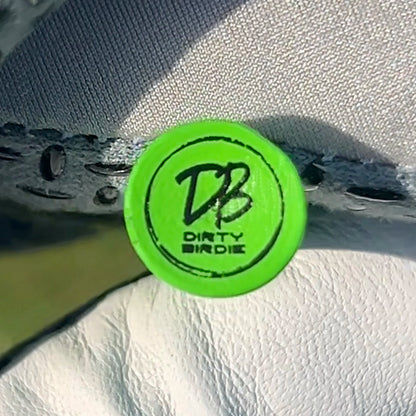 Close-up showing branded logo on top of golf tee head