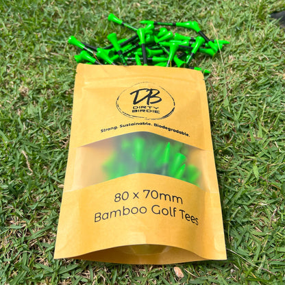 Resealable bag of strong golf tees spilling out onto tee box grass in sun